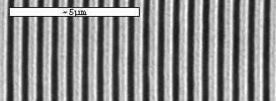 Figure 3.13 shows an SEM image of the gratings etched into the flat side of the D-fiber. These gratings cover a large portion of the flat surface of the fiber and are about 1.5 cm in length.