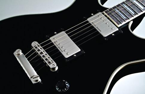 Equipped with dual Duncan Designed TM humbucking pickups with satin covers, plus a set neck featuring Pearloid block
