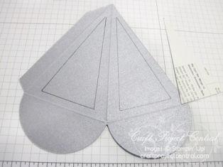 groove of the paper cutter (Step 2b). Repeat cut on the other side to create a triangle.