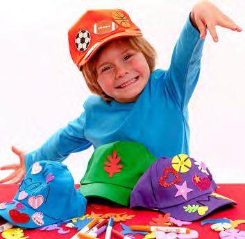 Children decorate a plain cap using an array of craft items.