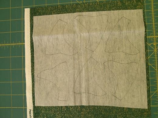 On the smooth side of the fusible strip, trace around the stem template 6 times, leaving at least 3/8 between the stems.