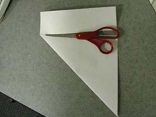 1 Fold up the corner of a rectangular sheet of paper diagonally so the side edges match up.