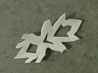 19 When you are finished cutting, very carefully unfold the snowflake.