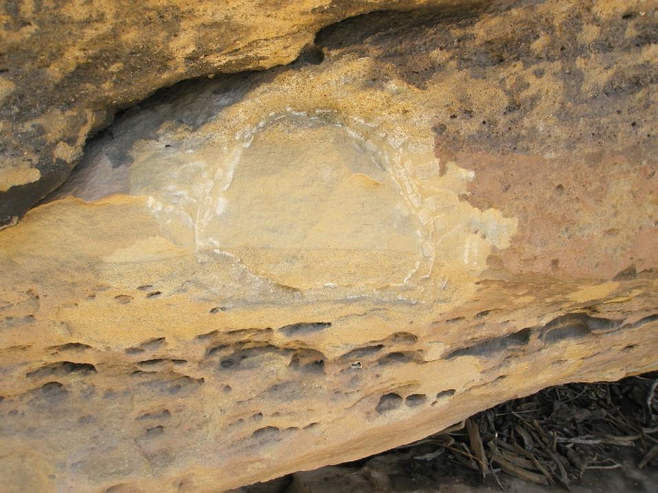 With much effort I got hold of the BLM and gave them the GPS coordinates. I asked them if they had a photo of what was originally there (petroglyph or pictograph), but I never received a reply.