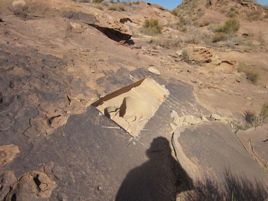 Below is an example of horizontal petroglyphs being blasted to make room