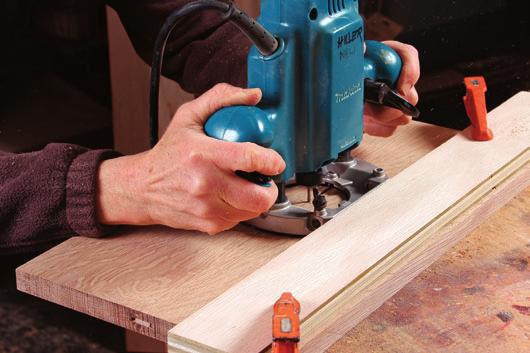 With the veneer taped to the workpiece, chop through the veneer to create the inlay
