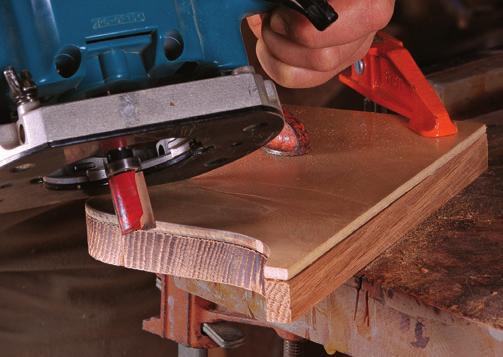 Align the saw with the layout lines and angle the blade downward as shown to cut as