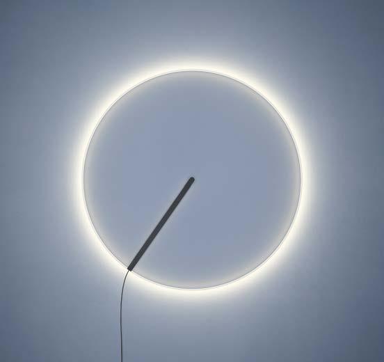 As with the solar eclipse the wall-light version glows with a tangential halo.