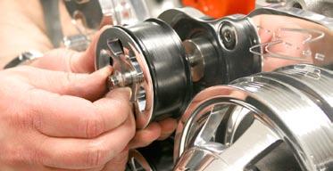 Pull up on wrench until tensioner pulley is able to slip onto tensioner