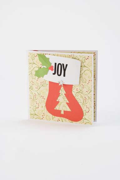 Cut a 12"x6" strip of white cardstock; score, fold, and trim uneven edges if necessary. 2. Cut three 5 3 4" squares of cream holly print paper. Attach one to the front of the card with glue.