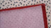 Stitch along this edge to hold the folds in place. I used matching red thread, but you can use a contrasting thread for fun, if you wish.