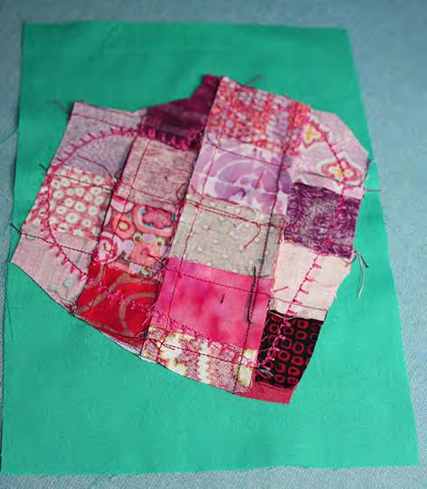 Turn the postcard front over and trim the excess patchwork fabric.