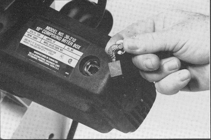 49, to keep arbor from turning. 7. Rotate arbor cover (B) Fig. 48, and lower guard (G) to the front and replace screw that was removed in STEP 2. Fig. 49 BRUSH INSPECTION AND REPLACEMENT CAUTION: BEFORE INSPECTING BRUSHES, DISCON- NECT THE MACHINE FROM THE POWER SOURCE.