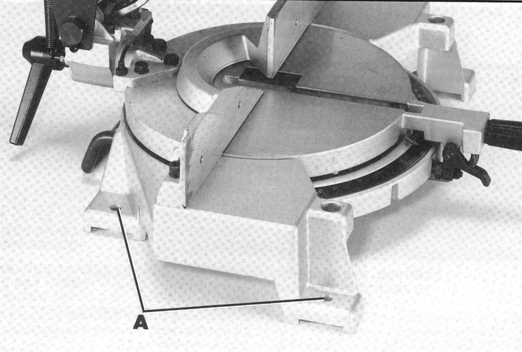 Fig. 9 FASTENING MACHINE TO SUPPORTING SURFACE Before operating your compound miter box, make sure it is firmly mounted to a workbench or other supporting surface.