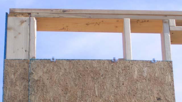 The exterior face of the gable end trusses must be sheathed with OSB before the rakes can be installed. Use the pre-cut pieces of OSB, or measure and cut pieces to fit as needed.