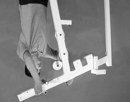 FIG. 11 Next, attach the Leg Extension Arm (#12), in the position as shown, to the Leg Extension Bench Frame (#11) and secure it into place using one Leg Extension Axle 1/2 X 2 1/2 (#9).
