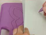 Take the concertina card, and crease down the centre line to fold the card in half.