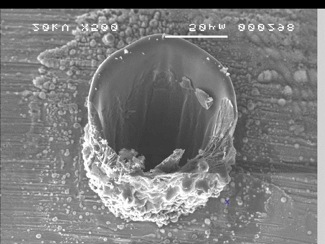 hole with no recast almost no debris Non-Optimum Laser