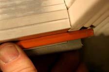 Step 3. Cut the sill adapter with a chop saw to the required length and cut drain holes into it so that any excess water can drain out.