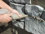 If any trimming is necessary, Figure 5 complete it now using a masonry hammer. Eye protection should be worn whenever splitting or cutting veneer stones.