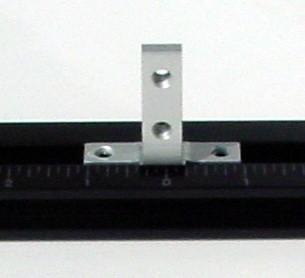Sliding t-nut tooling block. This component provides threaded holes perpendicular to the t-slot.