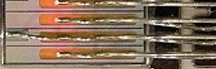 reduce the strain in the solder caused by the difference in coefficient of thermal expansion. Fig. 9 shows a photo of a comb-shaped lead interconnection.