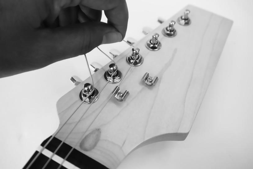 Be sure that each string is in the correct position on the saddle and in the correct string retainer. Then tune each string in turn to the correct pitch.