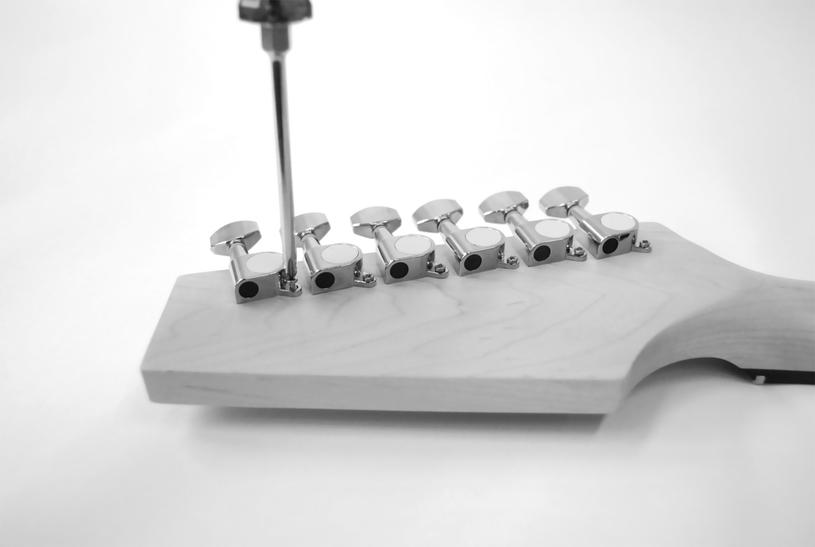 3.3 Mounting the tuners From the rear side of the headstock, insert the tuners into the holes provided.