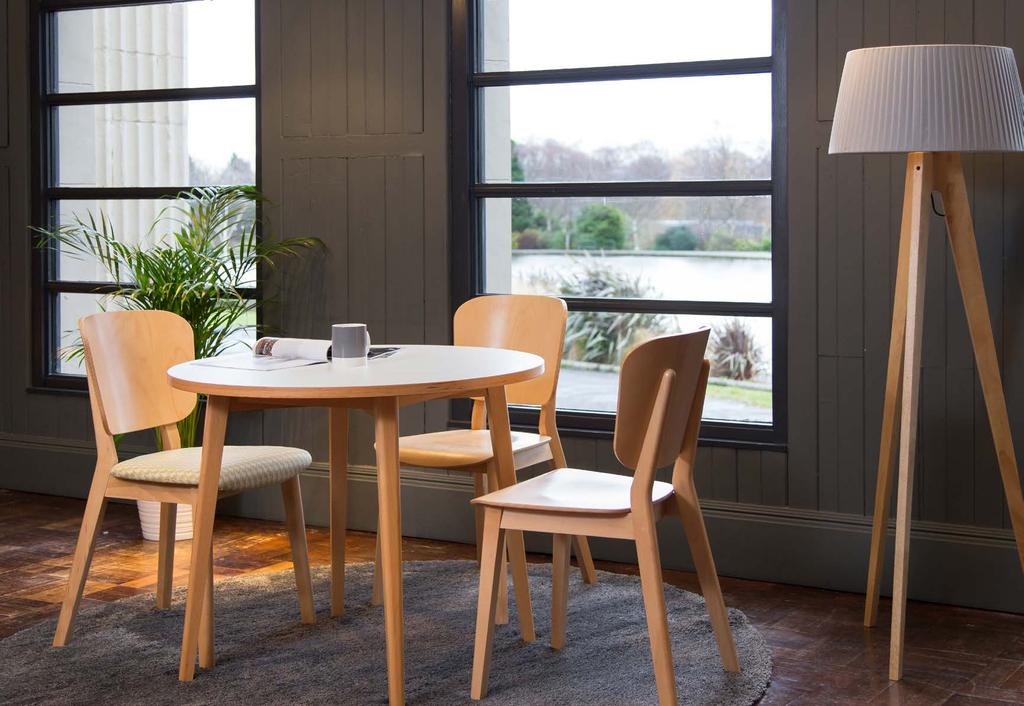 Above Rita chairs in polished natural beech with upholstered seat, and Jude dining table with beech finish.