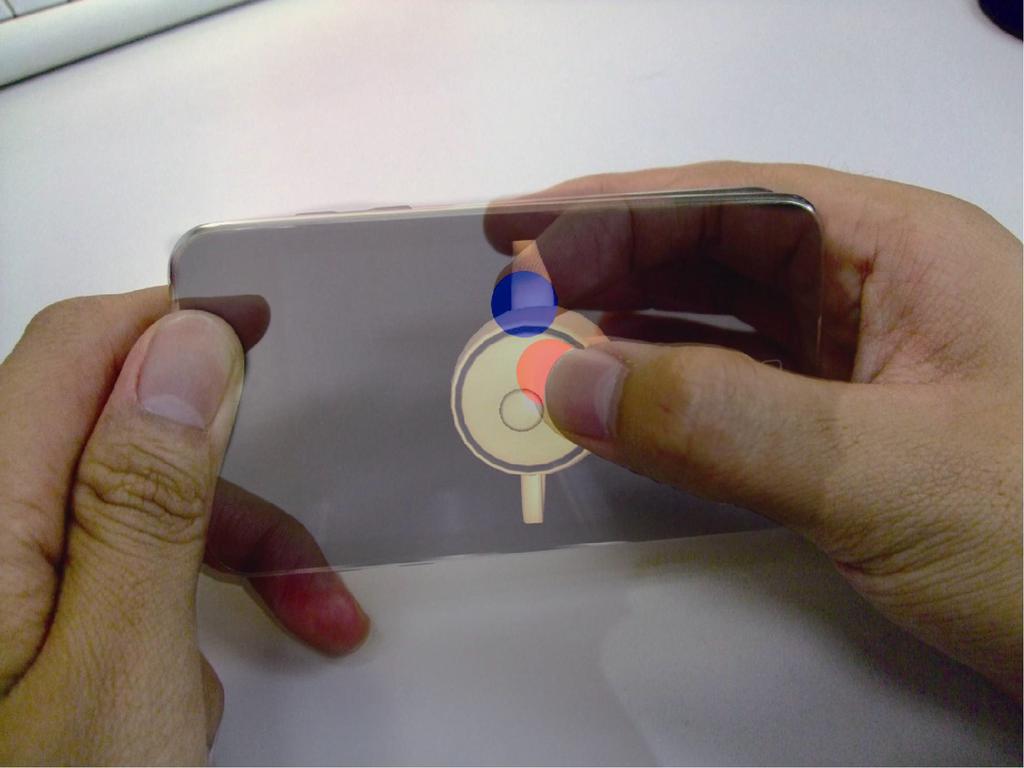 figure 1. The grab gesture. Transparency of ipod in the photo is adjusted to show the relative position of fingers. Two colored circles on screen indicate the position of touch points.