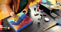 This hot wax painting technique involves using heated beeswax to which colored pigments are added and painted onto wood.