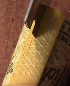 Do not make a score cut in the center of the cane, or the crack might travel up into the blades.