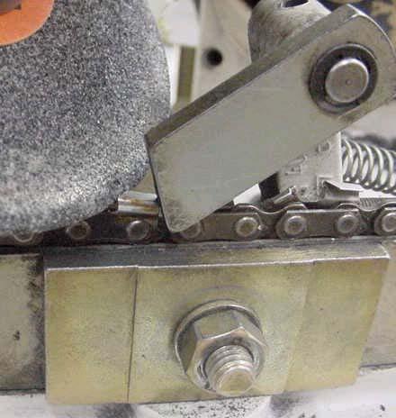 Set Limit Stops Do not start the machine. Pull the starting cutter back against the stop, which is adjustable in and out for each side of the chain.