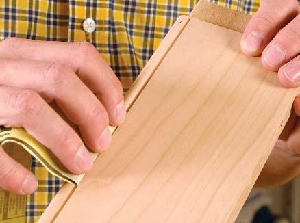 Contour the paper to fit curves in the wood. tire profile on all four sides of the panel with 180- or 220-grit paper.