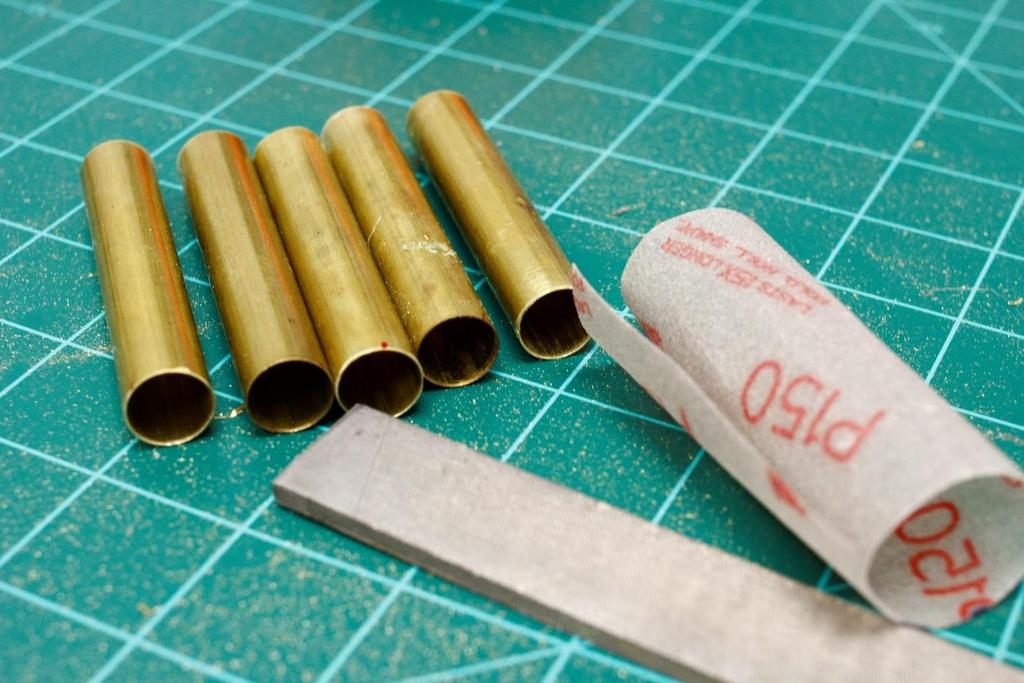 Step 2: File and sand the ends of your brass barrels.