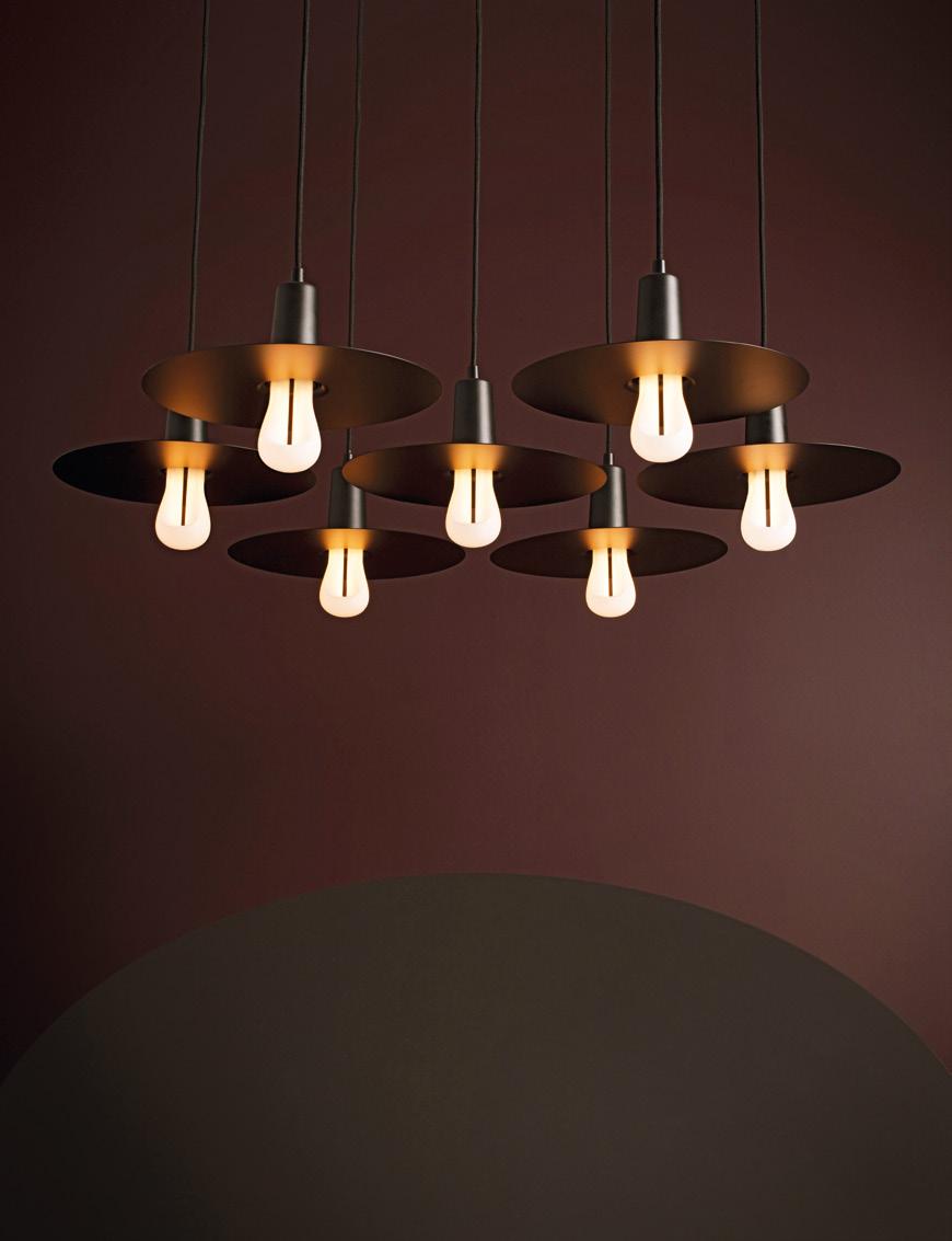 SHADES PLUMEN DROP HAT SHADE The Drop Hat Shade is a sleek metal disc, ideal for those who want to enjoy the beauty of a bare bulb in a refined and effortless lighting piece.