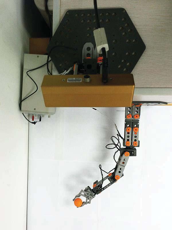 Picture A illustrates the entire hand-eye coordination platform. Picture B shows the motorized camera system. Picture C shows the top view of the platform.