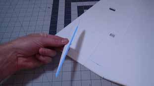 Place a bead of glue along the back flat area of