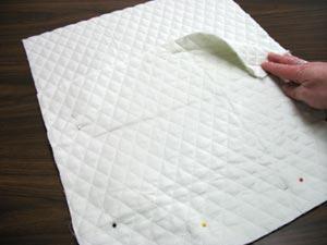 Lay the quilted cotton with the short ends together (small piece on the bottom end of the