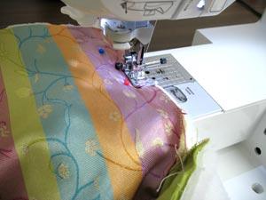 Sew a 1/2 inch seam along the top edge of the front (along the lining side) and along the