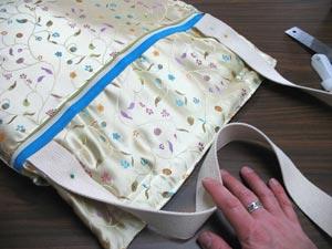 Pin in place and sew a seam around the edges of all the pieces. To add the strap, cut a 48 inch piece of the cotton strap.