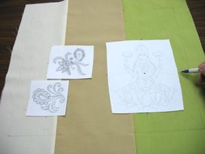 Create paper templates of the designs by printing them at full size using embroidery software. Trim around the designs to make them easy to place and rearrange.