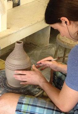 Students are directly involved in every aspect of the studio, from mixing glazes to loading and firing the kilns.