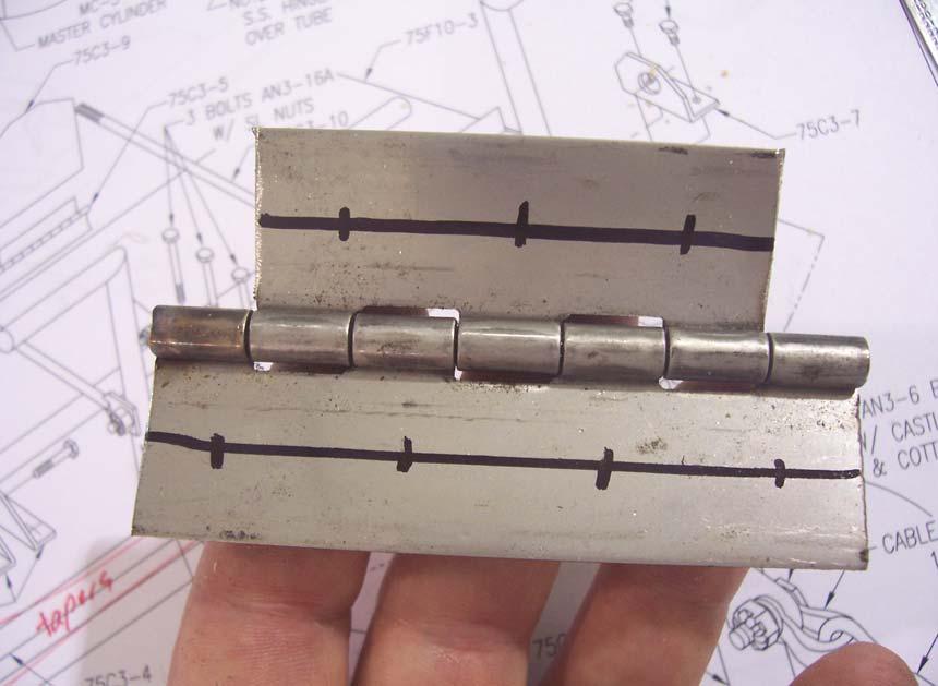 P/N: 75C3-5 S.S. Piano Hinge Draw center lines on both flanges of the S.S. Piano Hinge. Layout four rivet locations on the longer flange and three on the shorter flange.