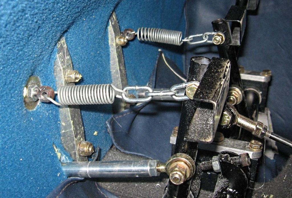 Fit the centring springs Anchor bolts Rudder travel stop The centring springs are attached by links of chain bolted to the top of the centre rudder pedals with AN3-11A bolts and then anchored to the