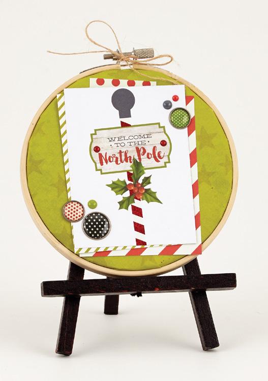Simple Tip: Back a small embroidery hoop with patterned paper and add a card and embellishments for a fun home