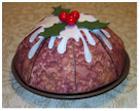 LAP060 Christmas Pudding Bowl Pudding shaped bowl with appliquéd icing and added holly leaves and beads as diameter or larger so