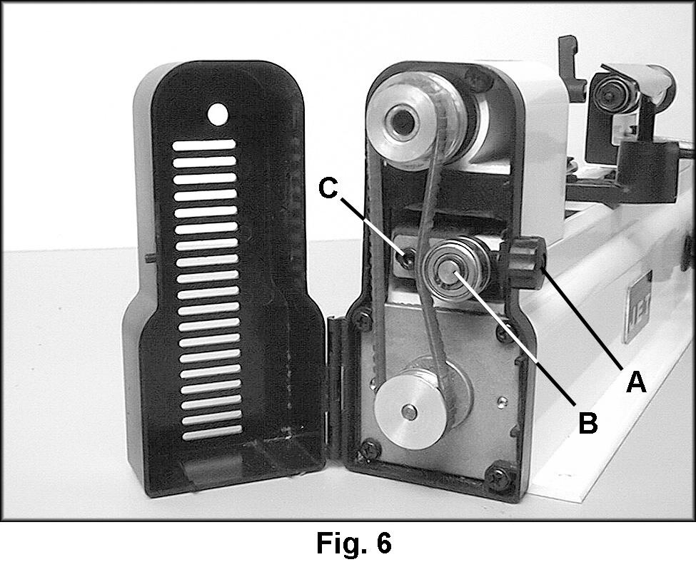 The piece must be re-inserted before operating the lathe. Belt Tension 1. To adjust tension of the drive belt, open the cover by turning the knob (A, Fig. 6) clockwise. 2. Loosen the screw (C, Fig.