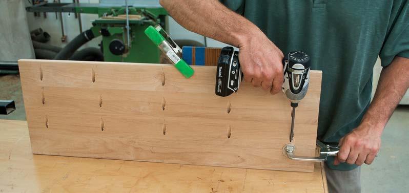 Use the marks on the slats to align them on the jig for drilling.