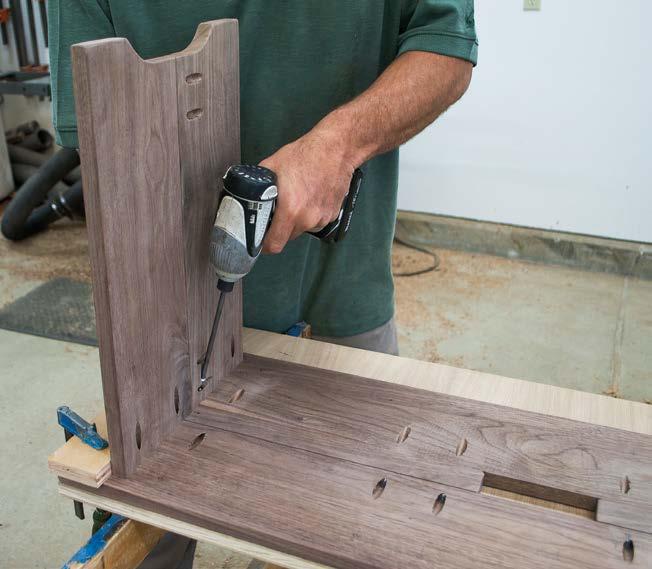 Measure and mark the benchtop to center the bench end in the same manner as before. Place the end against the skirts and clamp the 2 1 2-in.